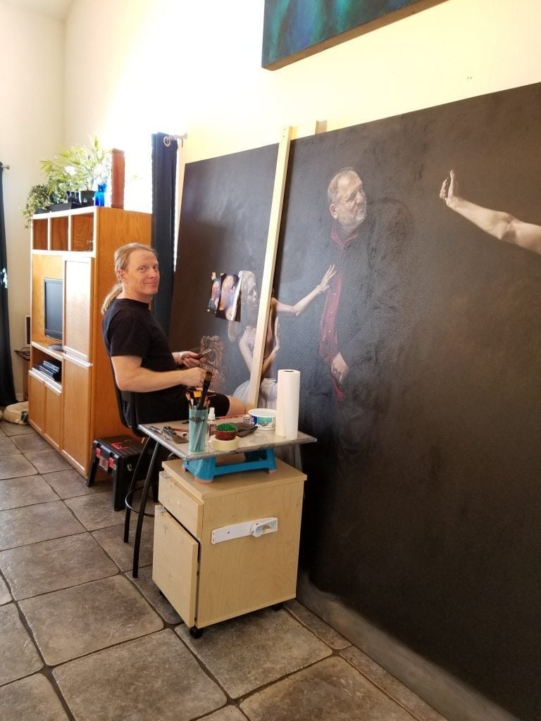 Florida artist Kevin Grass works on his large Not #MeToo: No More Casting Couch painting in his living room. 
