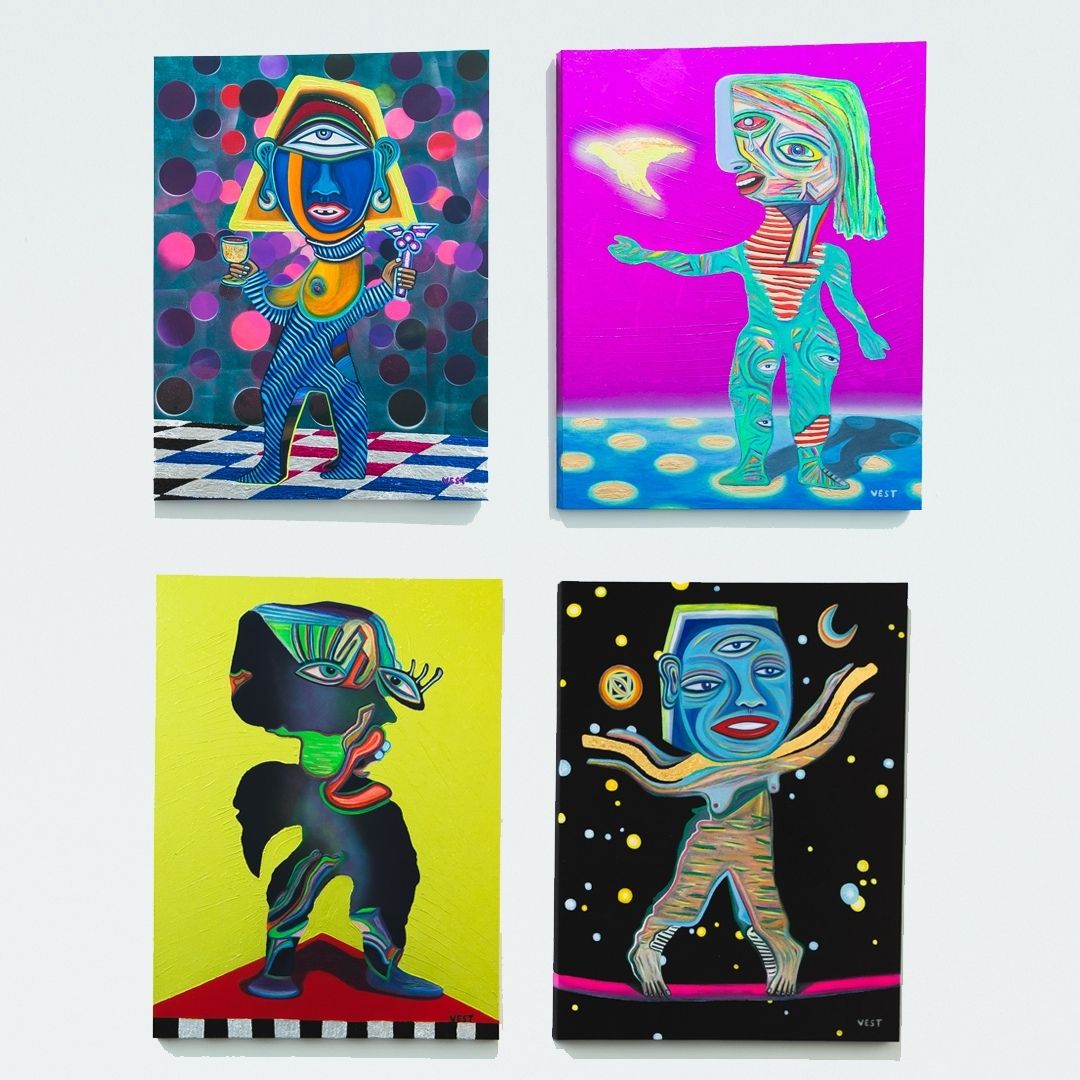 A group of paintings depict ethereal figures. 
